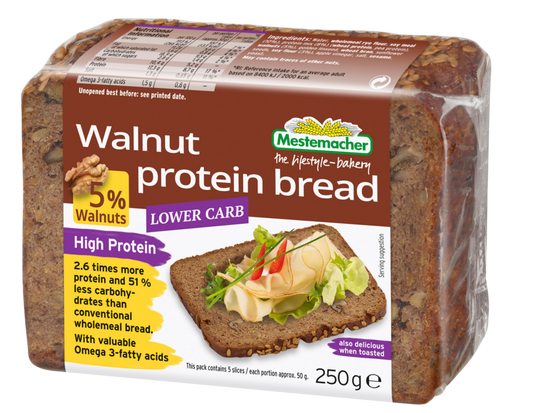 Packaged loaf of walnut protein bread with Mestmacher branding on a white background