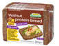 Packaged loaf of walnut protein bread with Mestmacher branding on a white background